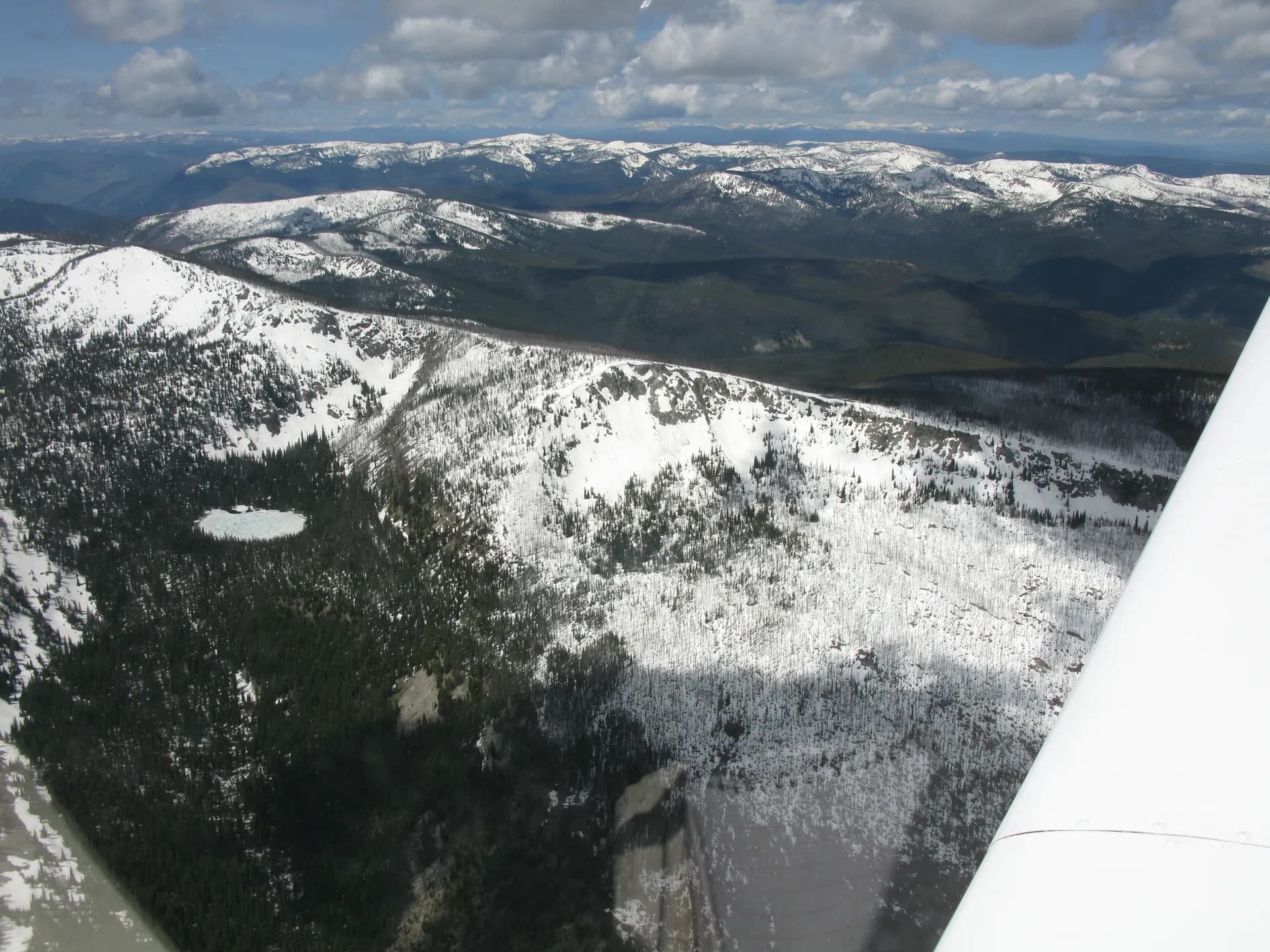 Aerial view of frozen Gold Pan Lake in the Bitterroot Mountains, Bitterroot National Forest, western Montana