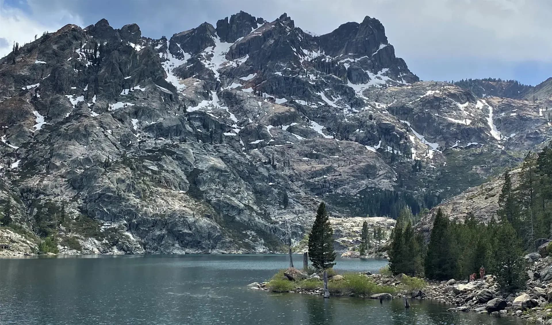 Upper Sardine Lake and the Sierra Buttes peaks rising above Plumas National Forest, California